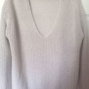 Jennifer Lopez long sleeve sweater.